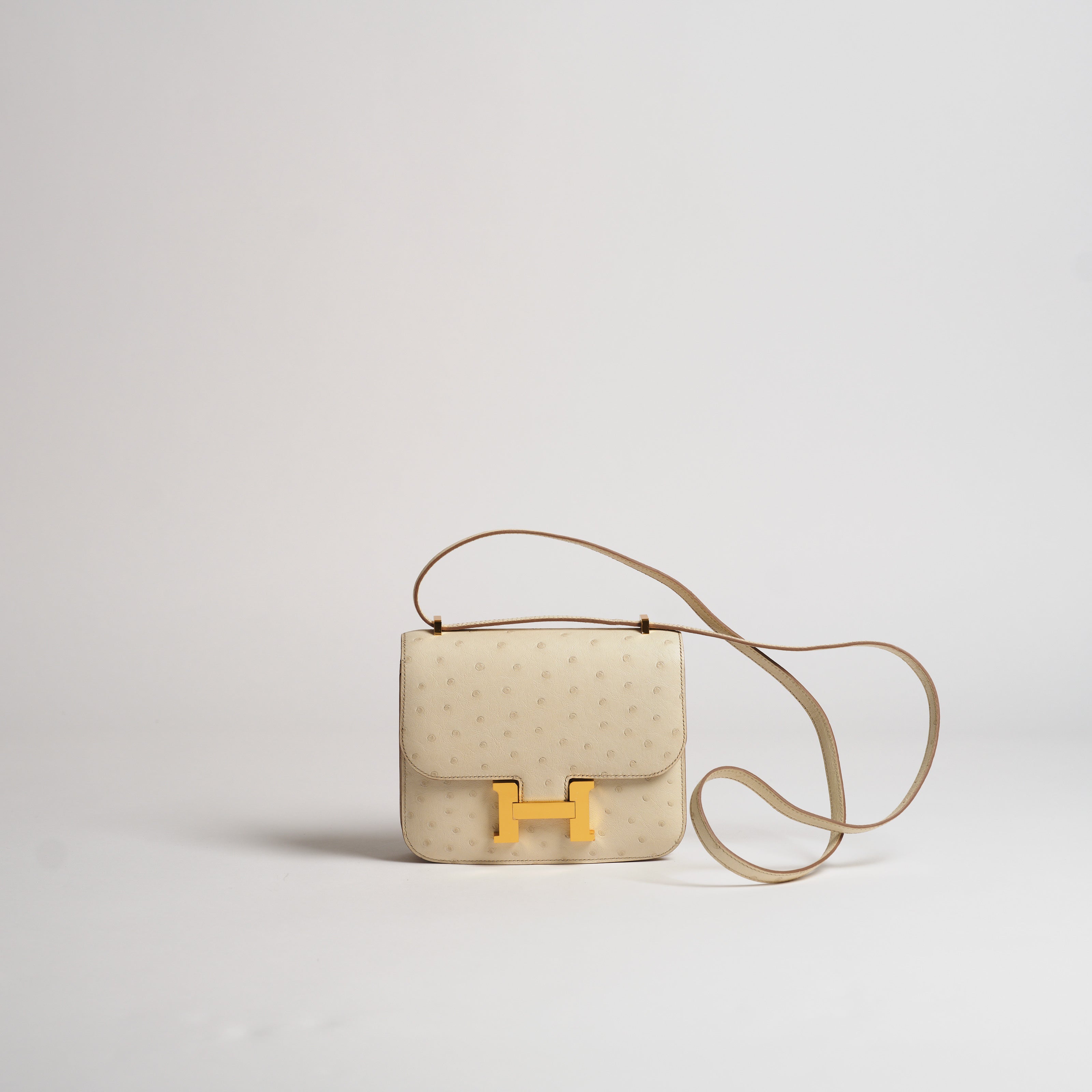 Hermès 18cm Mini Constance beton ostrich gold hardware
