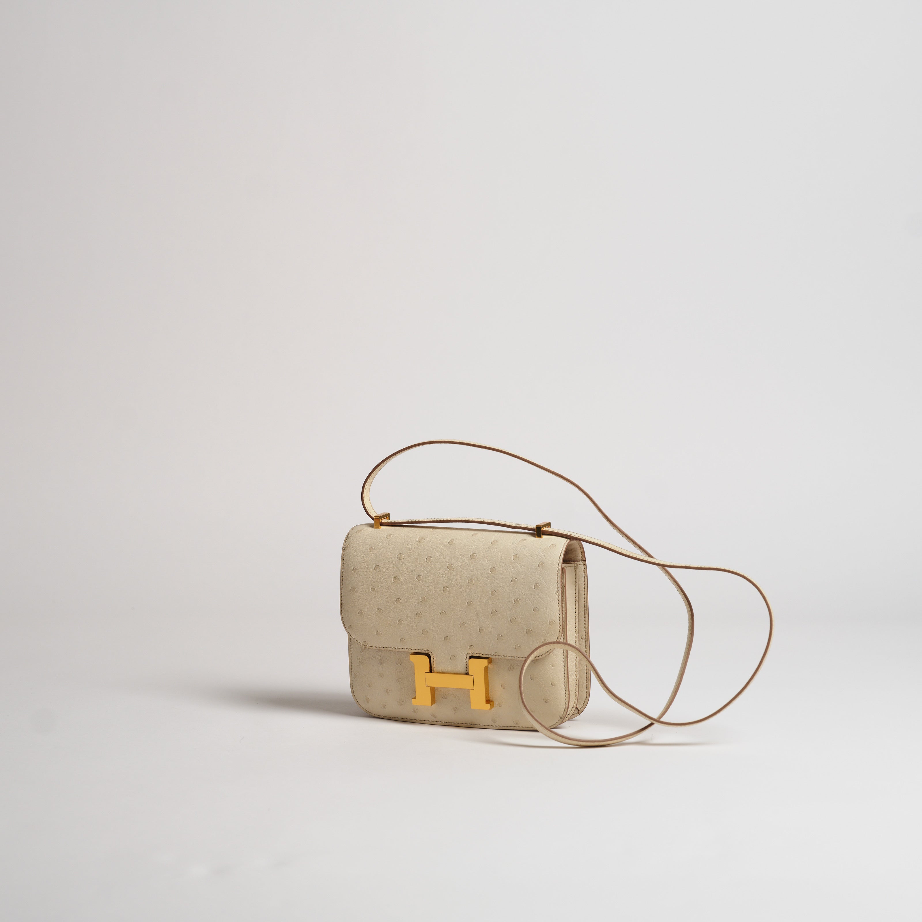 Hermès 18cm Mini Constance beton ostrich gold hardware