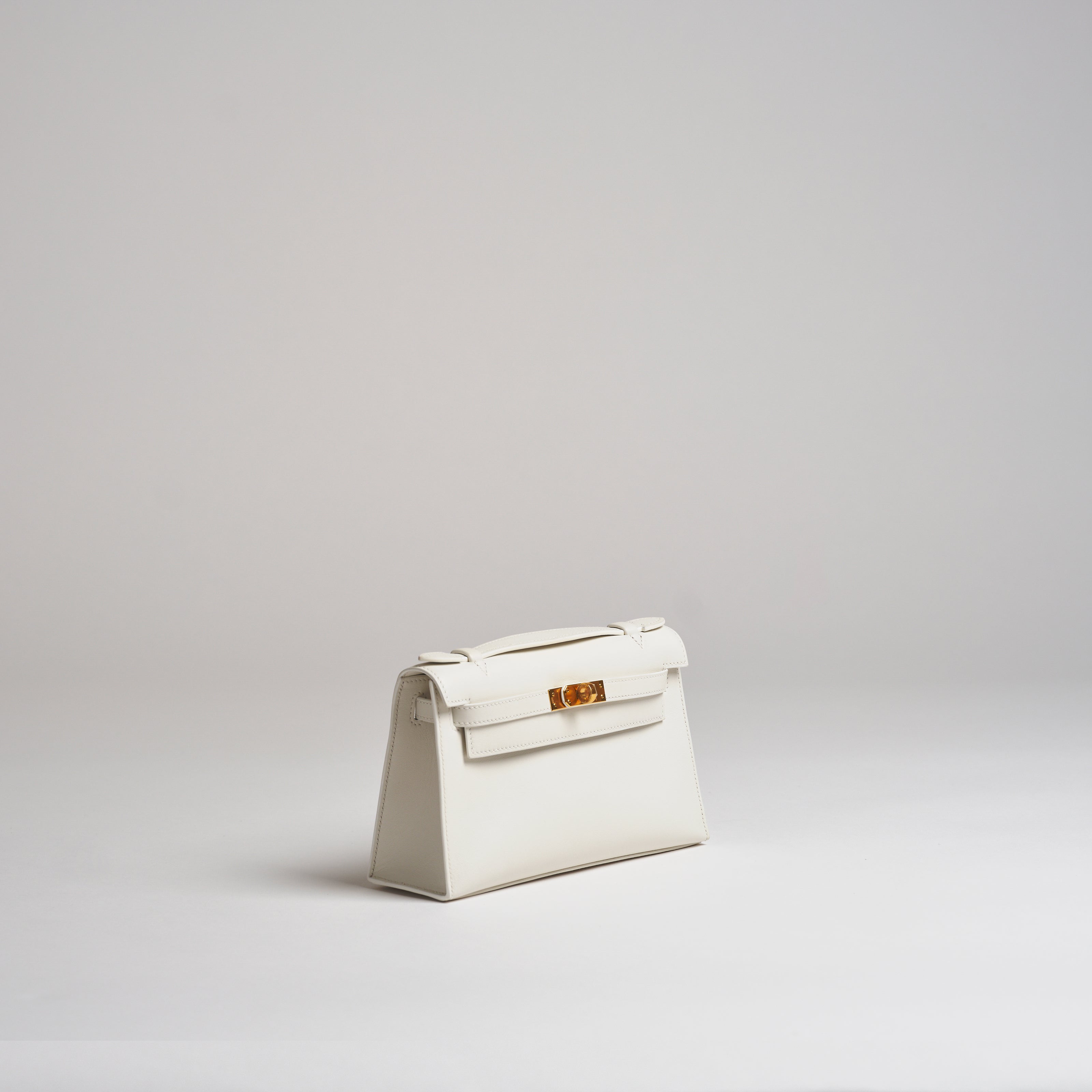 Hermès Mini Kelly Pochette white swift gold hardware