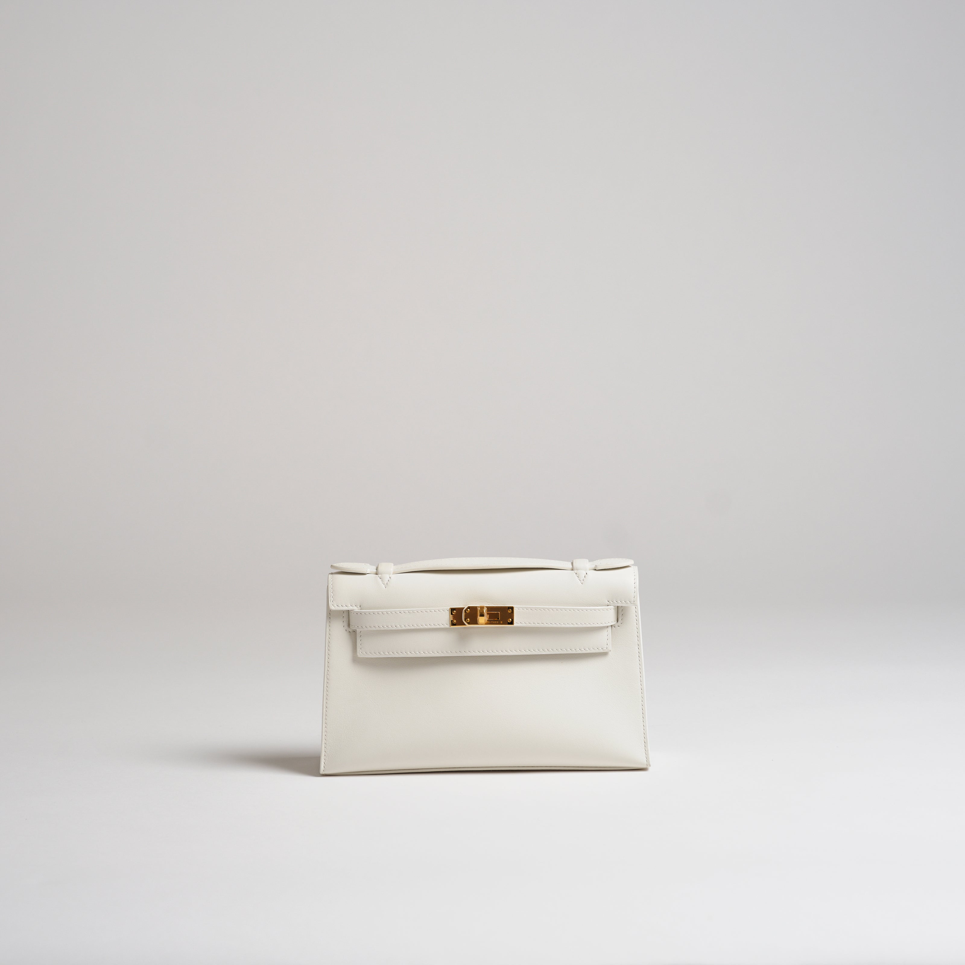 Hermès Mini Kelly Pochette white swift gold hardware