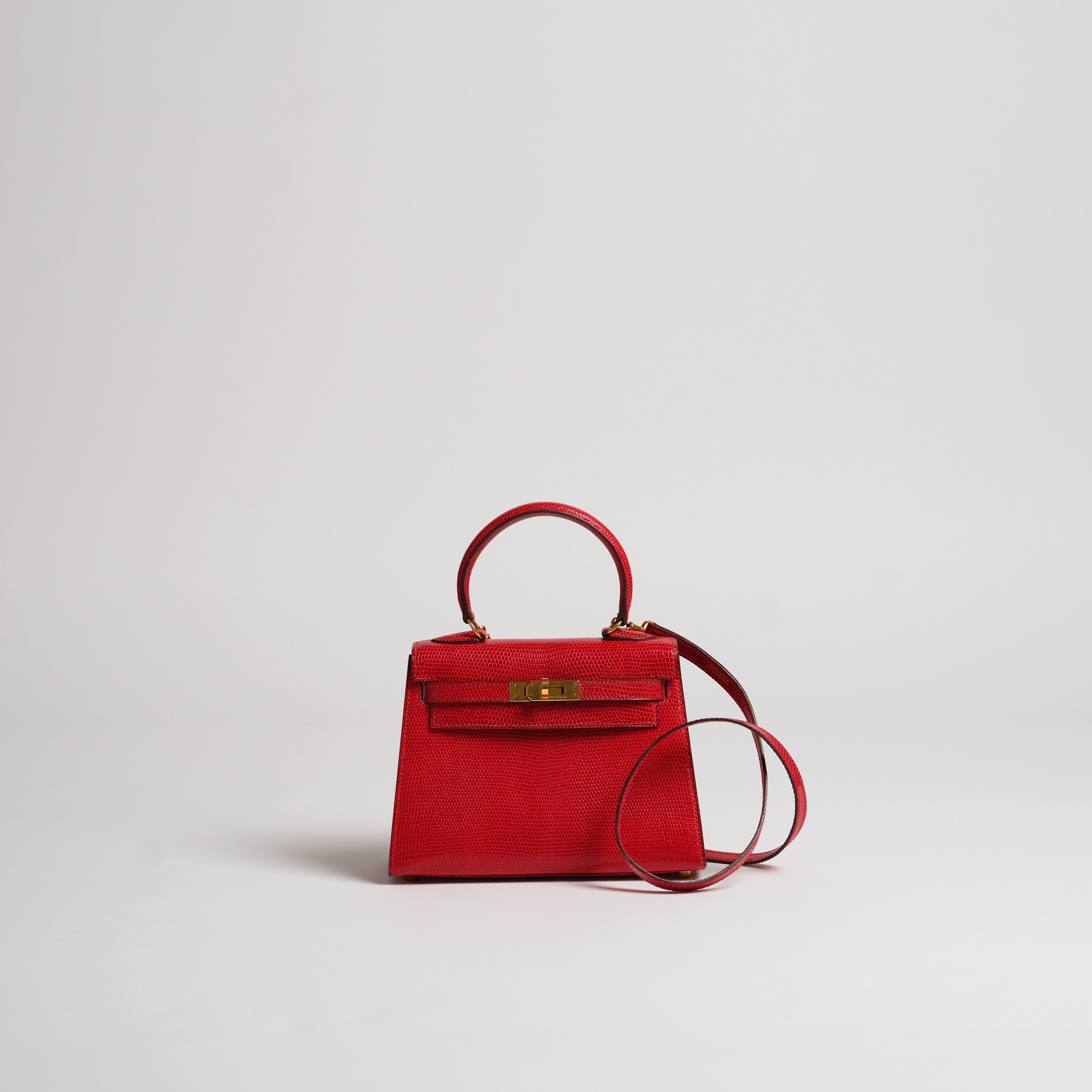 Vintage Hermès 20cm Kelly Sellier rouge vif lizard gold hardware