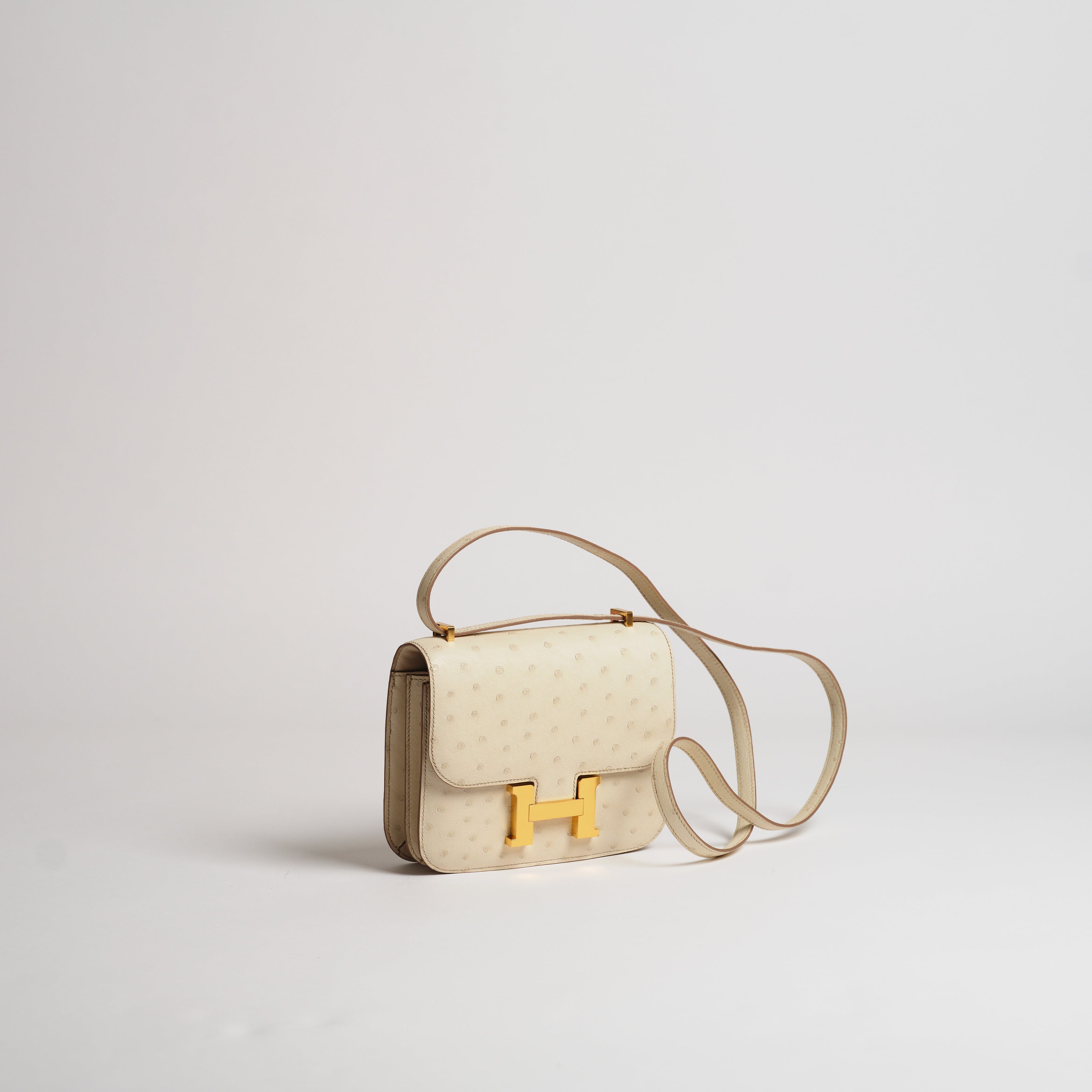 Hermès 18cm Mini Constance beton ostrich gold hardware