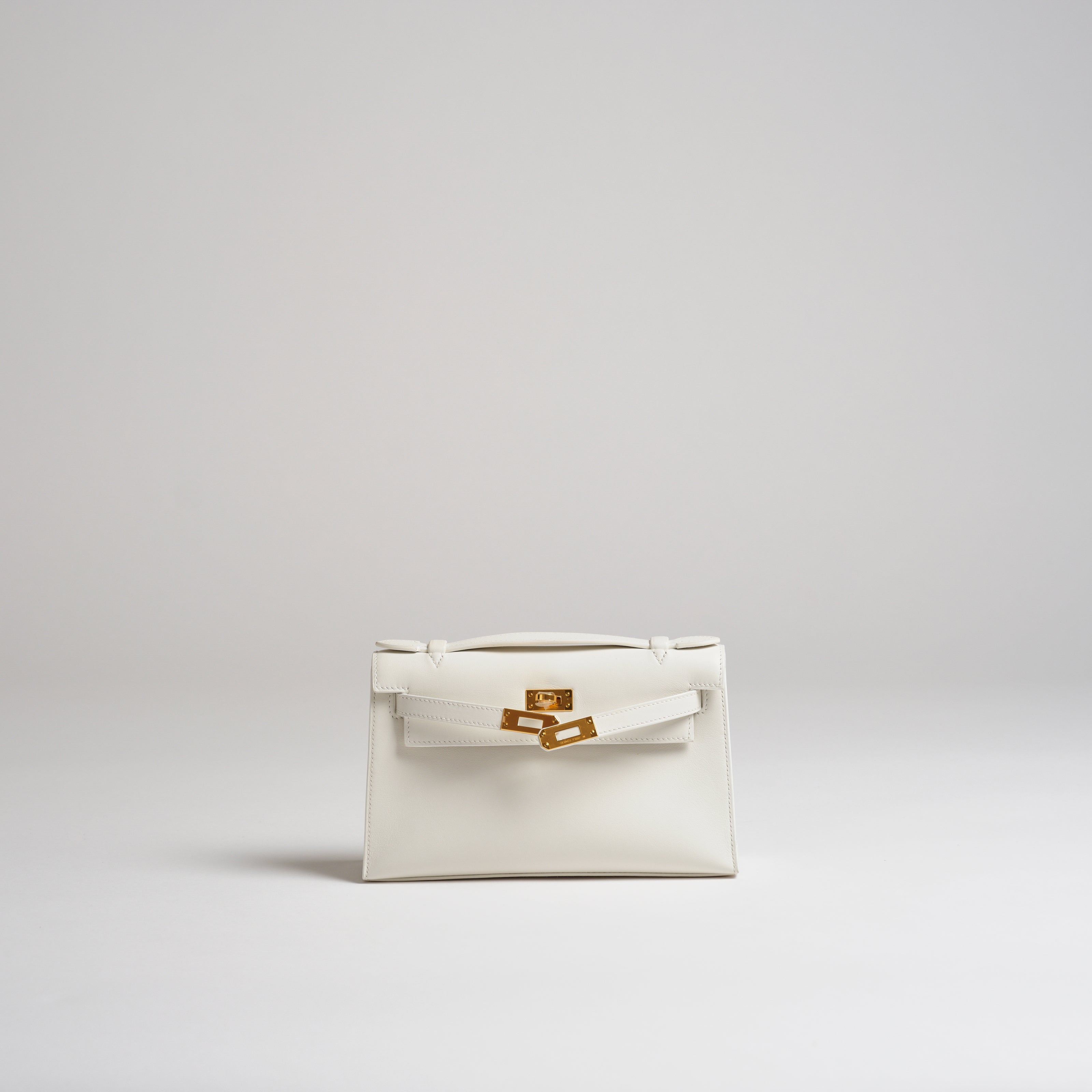 Hermès Mini Kelly Pochette white swift gold hardware