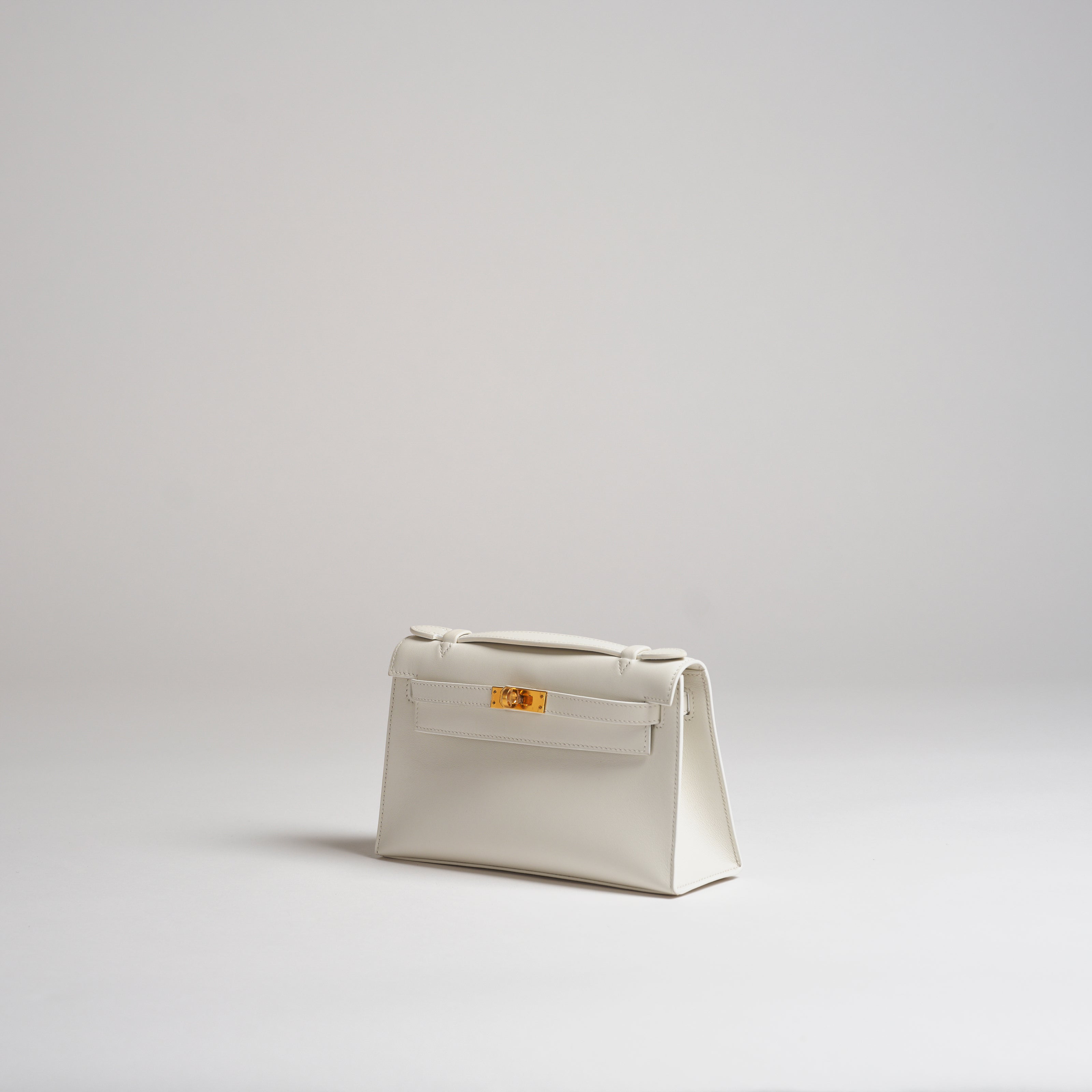 Hermès Mini Kelly Pochette white swift gold hardware